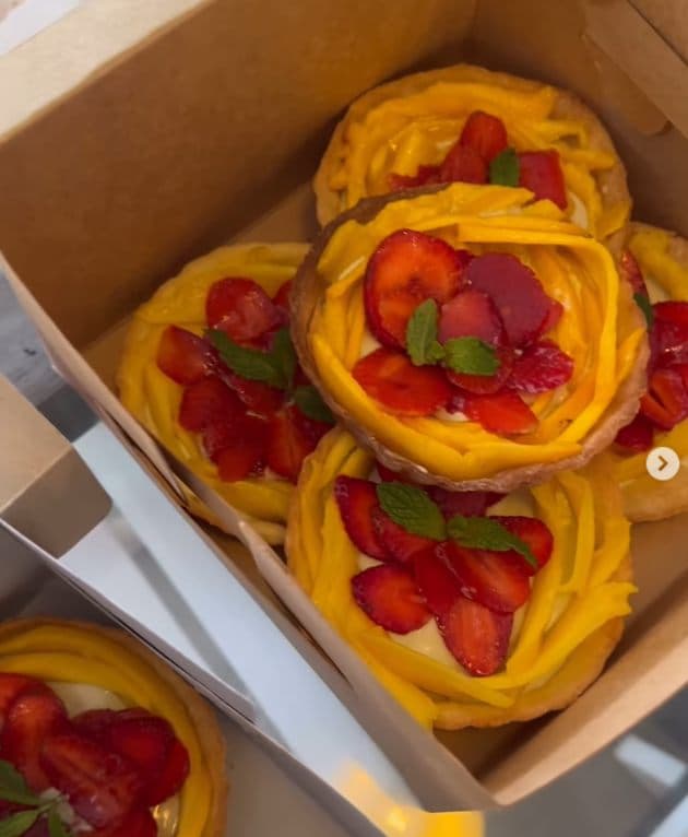 Mango tarts topped with strawberries and basil